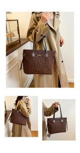 Close-up of leopard print tote bag detailing side drawstring and Creative Cat logo