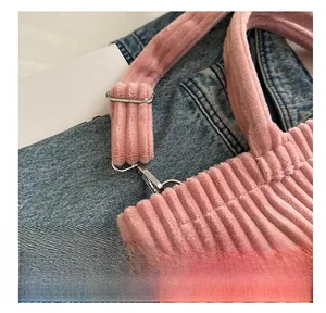 Close-up of pink corduroy tote bag featuring high-quality silver metal hook and strap detail