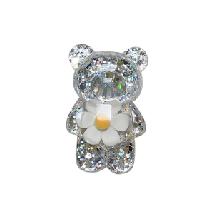 Glitzernder Bären Handyhalterung mit weißer Gänseblümchen Blume und großem Kristallstein