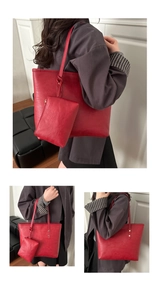 Detail of red minimalist tote bag set with matching inner pouch and pebbled leather texture