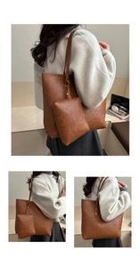 Close-up of vintage brown tote bag with pebbled leather texture and matching small pouch