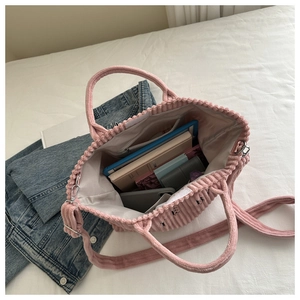 Macro view of large pink corduroy tote bag interior capacity with internal zipper pocket