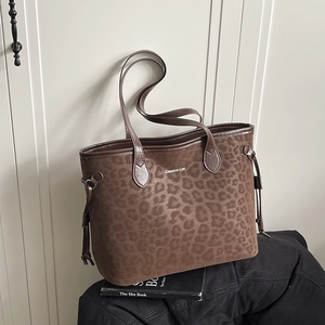 Brown leopard embossed large tote bag with Creative Cat logo on a book background