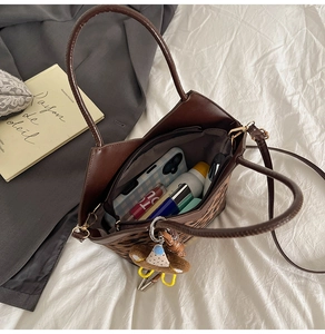 Detailed interior view of leopard print tote bag showing storage capacity and inner zipper
