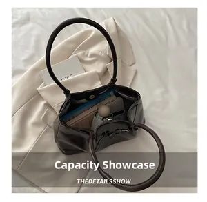 Top view of spacious dark brown tote bag showing internal storage for daily essentials