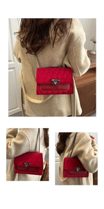 Detailed view of red velvet quilted crossbody bag with metallic chain and stud lock