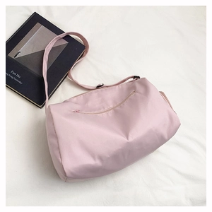 Detail view of pink large capacity yoga tote showing side pockets and smooth fabric texture