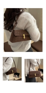 Detail of vintage leopard print shoulder bag with gold metal oval twist lock buckle