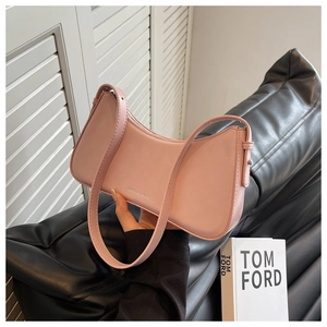 Detail of pink leather hobo bag with zip closure and adjustable shoulder strap