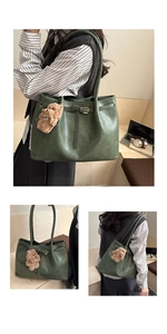Three-way view of deep green leather tote bag with brown plush bear charm detail