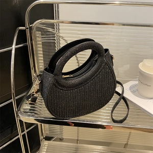 Sparkly black crescent handbag with pleated texture and golden chain strap for women