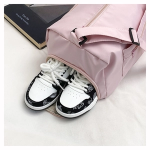 Pink travel bag with built-in independent shoe compartment for gym and weekend trips