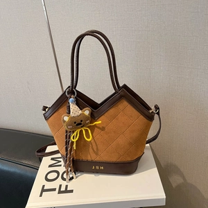 Brown suede bucket bag with diamond quilting, leather trim and cute bear charm