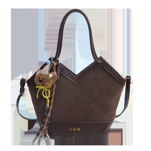 Brown quilted leather tote bag with a small bear pendant and JEH logo branding