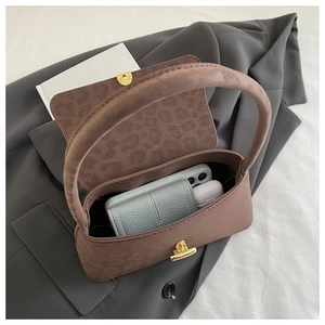 Top view showing the spacious interior of a brown suede bag with leopard print lining