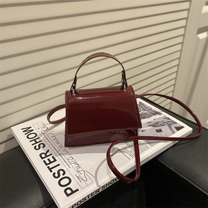 Chic burgundy patent leather mini square bag with top handle and crossbody strap