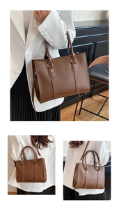 Detail of brown crocodile pattern tote bag with gold hardware and adjustable strap