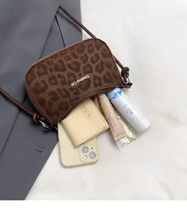 Macro view of leopard print shoulder bag with large capacity for cosmetics and phone