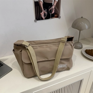 Minimalist khaki nylon messenger tote bag with large capacity and adjustable strap