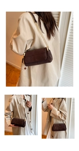 Close-up of deep brown suede shoulder bag with gold chain strap and metal lock
