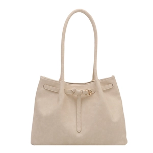 Beige tote bag with decorative buckle belt and long shoulder straps on white background