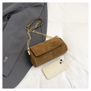 Brown faux suede messenger bag detail with gold chain strap and phone size comparison