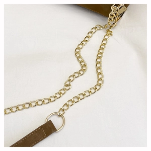 Close-up of olive green matte leather tote with polished gold chain strap and stitching