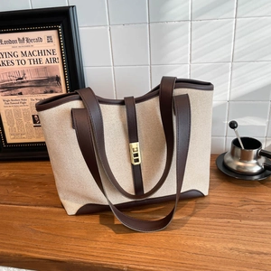 Retro canvas tote bag with brown leather trim and golden buckle for women's winter style