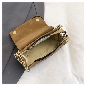 Interior view of brown tote bag showing main compartment, zipper pocket and magnetic closure