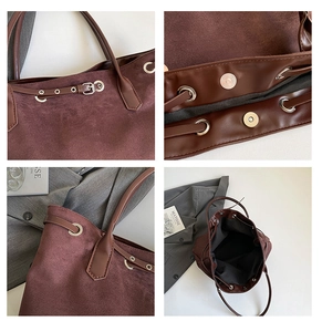 Detail of burgundy tote bag featuring faux suede texture, silver hardware and magnetic closure
