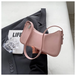 Detail of Morandi pink PU leather shoulder bag with zipper and embossed brand logo