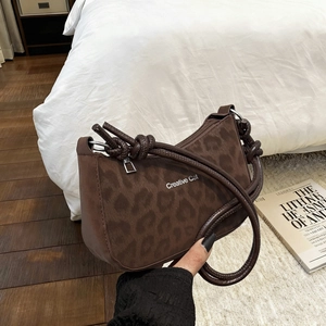 Minimalist leopard print shoulder bag with Creative Cat text and thick rope strap