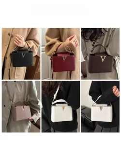 Collage of chic bucket bags in six colors with metallic V-buckle and lychee texture