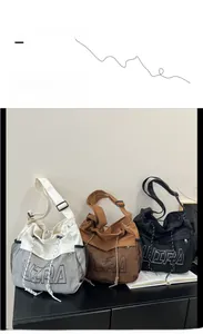 Three colors of oversized ULTRA hobo bags with mesh pockets and adjustable wide straps