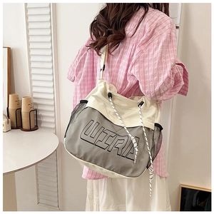 Close-up of the large capacity canvas tote bag featuring Ultra print and rope straps