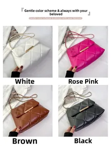 Quilted crossbody bag with chain strap shown in white, rose pink, brown and black colors