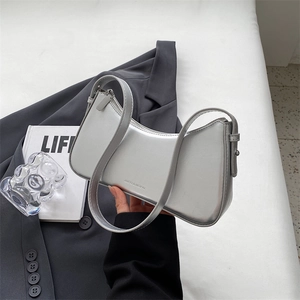 Chic silver metallic baguette bag with adjustable strap and minimalist brand logo