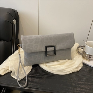 Gray leopard print suede clutch bag with black square buckle and wristlet strap