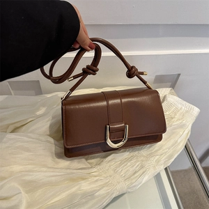 Retro dark brown leather crossbody bag with U-shaped silver buckle and knotted shoulder strap