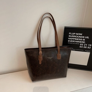 Vintage dark brown large tote bag with leather texture and adjustable shoulder strap