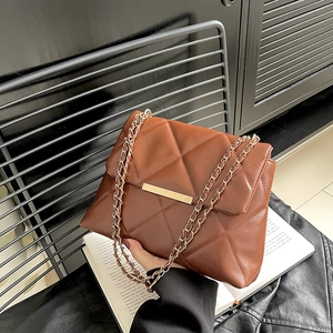 Quilted brown chain shoulder bag with gold hardware and elegant metal clasp detail