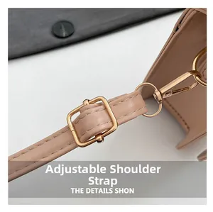 Detail of adjustable nude leather strap with gold buckle and stitching for shoulder bag