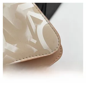 Detailed macro view of high-quality printed faux leather texture and precise edge stitching