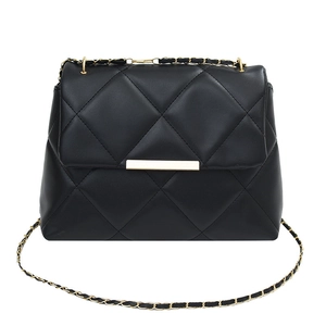 Black quilted crossbody bag with gold chain strap and sleek metal clasp on white background