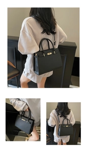 Detail showing high-quality lychee grain leather and golden twist-lock on black handbag