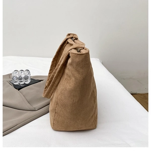 Detail of khaki corduroy tote bag showing soft ribbed texture and spacious design