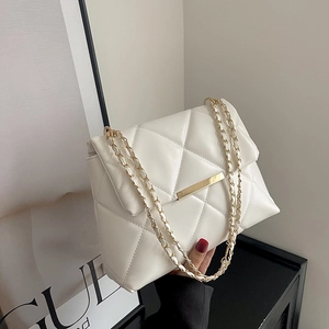 White quilted crossbody bag with gold chain strap and metallic buckle closure