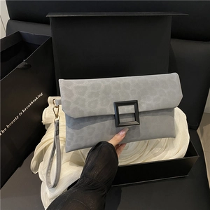 Gray leopard print envelope clutch bag with black buckle and detachable wrist strap
