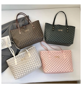 Top view of large tote bags in four colors with M-pattern and gold bow detail