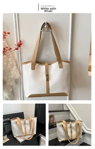 Close-up of woven tote bag showing khaki leather trim and gold metal lock detail